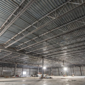 A commercial building with exposed steel before the application of fireproofing in K-13 insulation